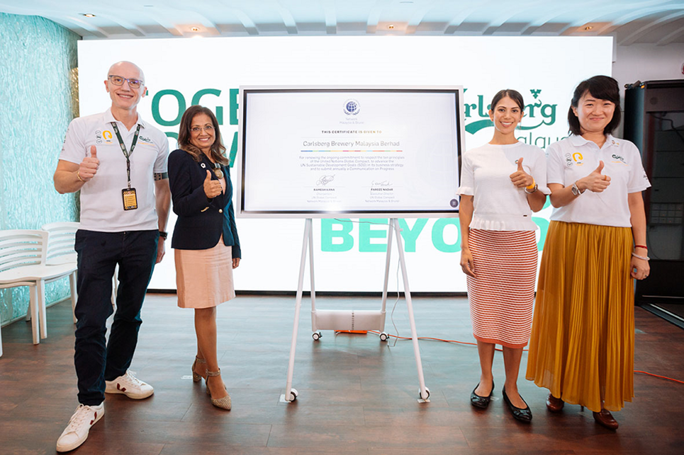 Carlsberg Malaysia renews its commitment to Climate Governance Malaysia (represented by Dr Kalanithi Nesaretnam - second from left) and UNGCMYB  (represented by Ms Shanta Dwarkasing - second from right).